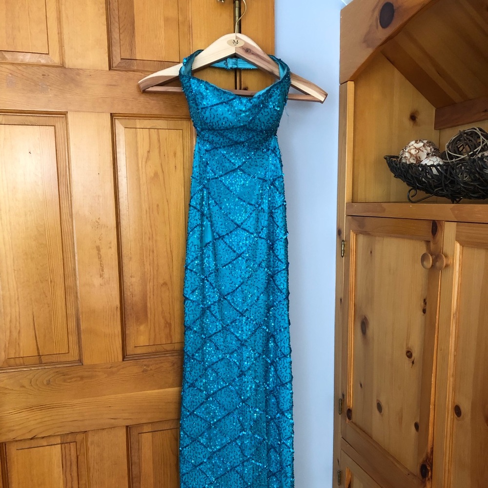 Strapless/backless blue sequin gown